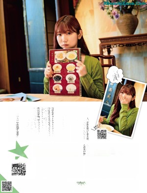 A woman in an apron standing behind a counter in a kitchen.