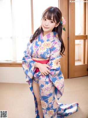 A woman in a purple kimono posing for the camera.