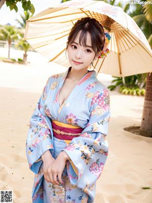 A woman in a blue and pink kimono posing for a picture.