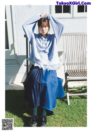 A magazine with a picture of a young woman on the cover.