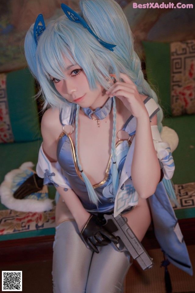 A woman with blue hair holding a gun.